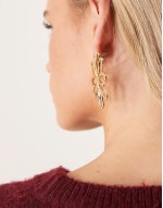 large flower stud earrings in gold